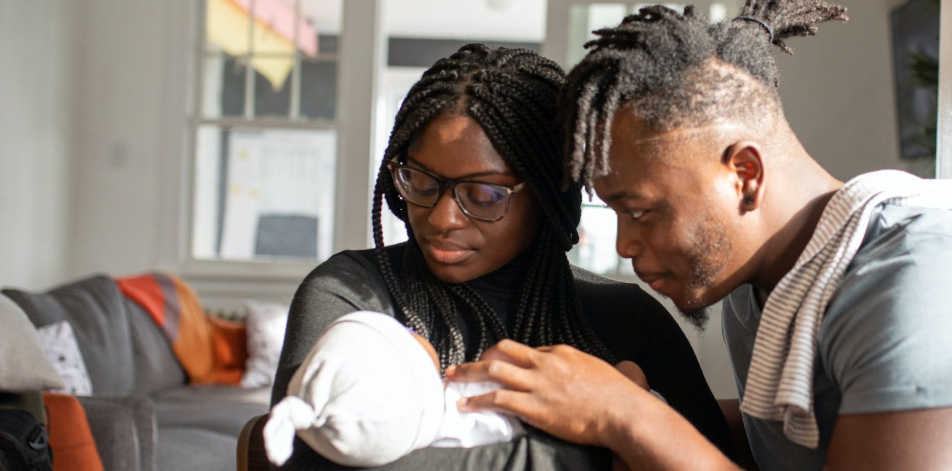 Parents Looking at their Baby